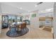 Inviting living area with balcony access, offering views and seamless flow to the kitchen and dining space at 17710 Gulf Blvd # 304, Redington Shores, FL 33708