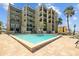 Outdoor pool with lounge chairs, perfect for relaxation and soaking up the sun on a beautiful day at 17710 Gulf Blvd # 304, Redington Shores, FL 33708
