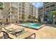 Relaxing poolside lounge area perfect for unwinding and enjoying the Florida sunshine and building views at 17710 Gulf Blvd # 304, Redington Shores, FL 33708