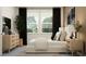 Serene bedroom with natural light, neutral tones, and stylish modern furniture at 18154 Serene Lake Loop, Lutz, FL 33548