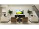 Comfortable living room with neutral decor, featuring stylish seating and a modern entertainment center, creating a serene space at 18154 Serene Lake Loop, Lutz, FL 33548