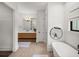 Bright bathroom features a modern vanity, soaking tub, and stylish fixtures at 18577 Clay Hill Rd, Dade City, FL 33523