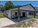 Exterior view of a barn with a covered awning at 18577 Clay Hill Rd, Dade City, FL 33523