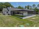 Aerial view of the screened-in pool and backyard of the modern farmhouse at 18577 Clay Hill Rd, Dade City, FL 33523