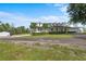 Charming single-story home featuring a well-maintained lawn, surrounded by mature trees at 18577 Clay Hill Rd, Dade City, FL 33523