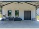 Exterior view of a barn with a covered awning at 18577 Clay Hill Rd, Dade City, FL 33523