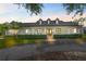 Well-maintained home with manicured front lawn and inviting covered porch at 18577 Clay Hill Rd, Dade City, FL 33523