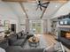 Spacious living room with hardwood floors, a fireplace, and a view of the pool at 18577 Clay Hill Rd, Dade City, FL 33523