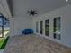 Covered outdoor space with brick flooring, white walls, and French doors at 18577 Clay Hill Rd, Dade City, FL 33523