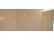 Tiled shower and neutral walls complete the bathroom at 1922 Sassafras Dr, Wesley Chapel, FL 33543