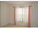 Bright bedroom with natural light provided by a large window and pretty curtains at 1922 Sassafras Dr, Wesley Chapel, FL 33543