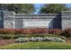 Stone community entrance sign 'LONGLEAF' set among attractive shrubs and manicured lawn creating a welcoming atmosphere at 1922 Sassafras Dr, Wesley Chapel, FL 33543