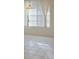 Bright dining area with tile flooring, a pendant light, and natural light from a large window at 1922 Sassafras Dr, Wesley Chapel, FL 33543