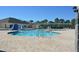 Bright community pool featuring a spacious deck, covered seating, and lush landscaping perfect for relaxation and recreation at 1922 Sassafras Dr, Wesley Chapel, FL 33543