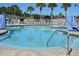 Beautiful community pool featuring comfortable seating, lounge chairs and plenty of room for relaxing at 1922 Sassafras Dr, Wesley Chapel, FL 33543