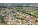Overhead view of community with mature trees, ponds, and easy access to highway at 202 Grayson Ct, Sun City Center, FL 33573