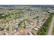 Aerial view of residential area surrounded by lakes, parks, and roadway at 202 Grayson Ct, Sun City Center, FL 33573