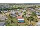Aerial view of home with screened pool in a residential community at 202 Grayson Ct, Sun City Center, FL 33573