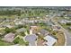 Breathtaking aerial view captures a charming residential community, complete with lakes and a golf course nearby at 202 Grayson Ct, Sun City Center, FL 33573