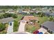 Aerial shot of a home with a screened-in pool and lush landscaping at 202 Grayson Ct, Sun City Center, FL 33573