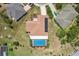 Real estate showcasing home with solar panels and screened in pool at 202 Grayson Ct, Sun City Center, FL 33573