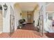 Charming front porch with tile flooring, gated entry, and plenty of space for seating at 202 Grayson Ct, Sun City Center, FL 33573