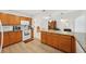 Well-appointed kitchen with granite countertops and warm wood cabinetry at 202 Grayson Ct, Sun City Center, FL 33573
