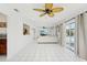Bright living room area with views of the kitchen and pool, offering great natural light at 202 Grayson Ct, Sun City Center, FL 33573