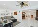 Bright living room area leading to the kitchen and dining area, promoting a spacious feel at 202 Grayson Ct, Sun City Center, FL 33573