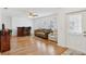 Bright living room with hardwood floors, a comfortable sofa, and ample natural light at 202 Grayson Ct, Sun City Center, FL 33573