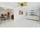 Bright living room area leading to the dining area, promoting a spacious feel at 202 Grayson Ct, Sun City Center, FL 33573