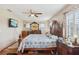 Large main bedroom features a ceiling fan and a mounted television at 202 Grayson Ct, Sun City Center, FL 33573