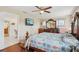 Spacious main bedroom with hardwood floors and a ceiling fan at 202 Grayson Ct, Sun City Center, FL 33573