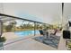 A screened in pool area with an in-ground pool and plenty of room for entertaining at 202 Grayson Ct, Sun City Center, FL 33573