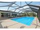 This stunning in-ground pool has a protective enclosure perfect for safe swimming and outdoor enjoyment at 202 Grayson Ct, Sun City Center, FL 33573