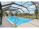 A refreshing screened-in pool surrounded by an outdoor living area at 202 Grayson Ct, Sun City Center, FL 33573
