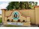 Inviting Paradise Lakes community sign featuring a decorative monument and manicured landscaping at 21103 Patio View Ct # 3302, Lutz, FL 33558