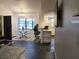 Open-concept dining area adjacent to the living room and kitchen, featuring barstool seating at 21103 Patio View Ct # 3302, Lutz, FL 33558