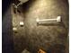 Tiled shower features updated showerhead and convenient towel rack at 21103 Patio View Ct # 3302, Lutz, FL 33558