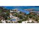 Aerial view of a neighborhood highlighting nearby marina, park, restaurants, and the house location at 214 Scotland St, Dunedin, FL 34698