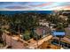 Aerial view of a cozy home with lush surroundings and a glimpse of the bay at 214 Scotland St, Dunedin, FL 34698