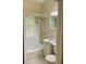 Cozy bathroom features a shower/tub combination and a vanity with a sink at 214 Scotland St, Dunedin, FL 34698