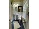 Light-filled bathroom featuring a pedestal sink, tiled floors, and neutral decor at 214 Scotland St, Dunedin, FL 34698