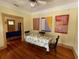 Cozy dining area featuring hardwood floors and bright, colorful artwork on the walls at 214 Scotland St, Dunedin, FL 34698