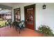 Cozy front porch with comfortable seating and charming architectural details at 214 Scotland St, Dunedin, FL 34698