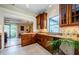 Beautiful kitchen featuring custom cabinetry, granite countertops, and modern appliances at 214 Scotland St, Dunedin, FL 34698