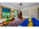 Bright living room with hardwood floors, a cozy sofa, and charming vintage accents at 214 Scotland St, Dunedin, FL 34698