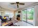Bright living room with skylight and sliding glass doors leading to the outdoor patio at 214 Scotland St, Dunedin, FL 34698