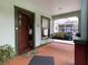 Inviting porch with a swing, featuring a cozy and relaxing outdoor space at 214 Scotland St, Dunedin, FL 34698