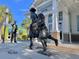 Artistic statue in front of the Dunedin History Museum, enhancing the cultural richness of the community at 214 Scotland St, Dunedin, FL 34698